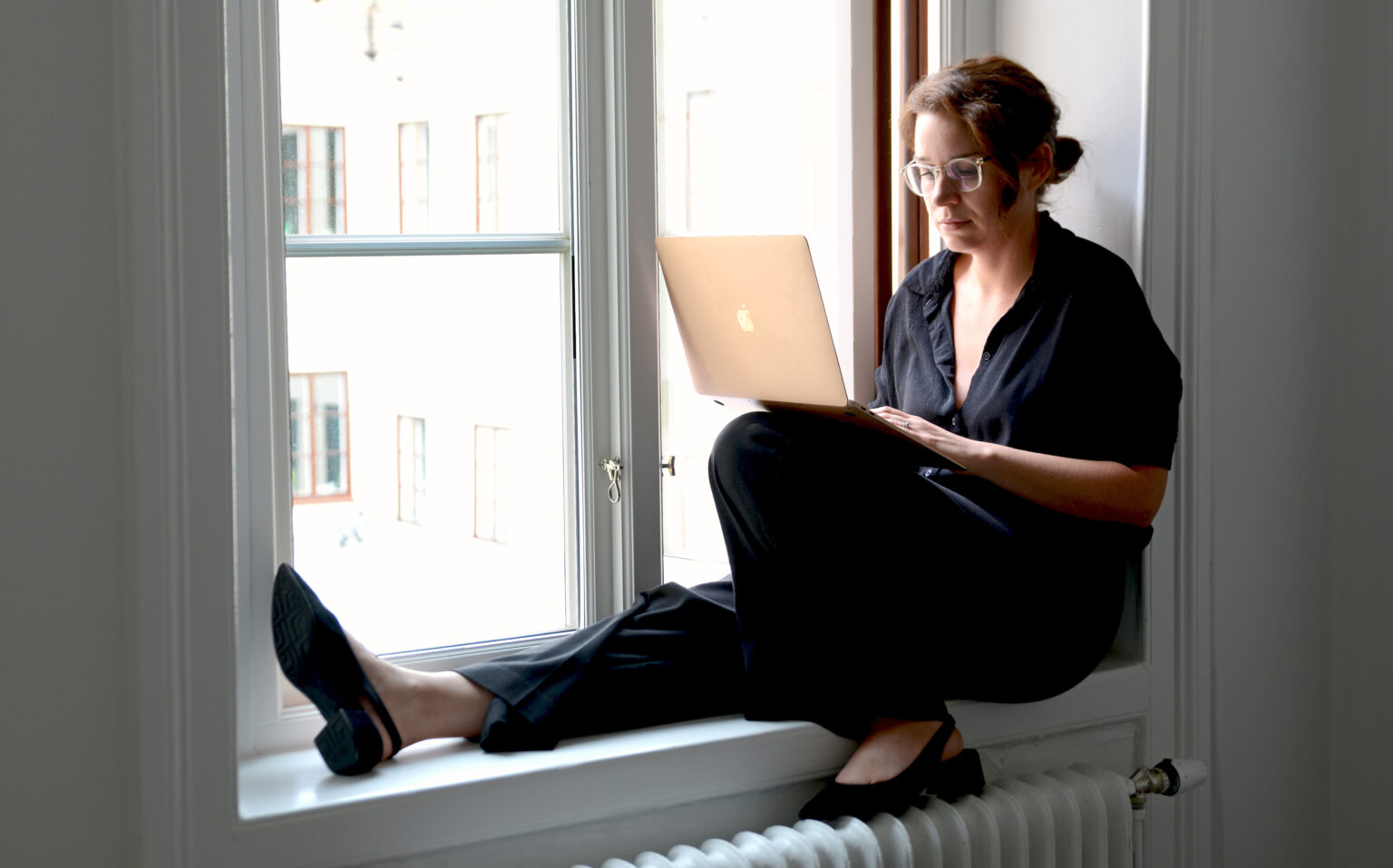 Game-based learning. Person sits by the window